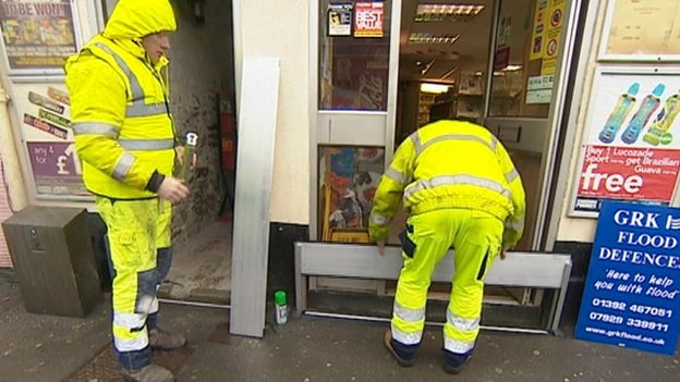 flood board being installed at a shop