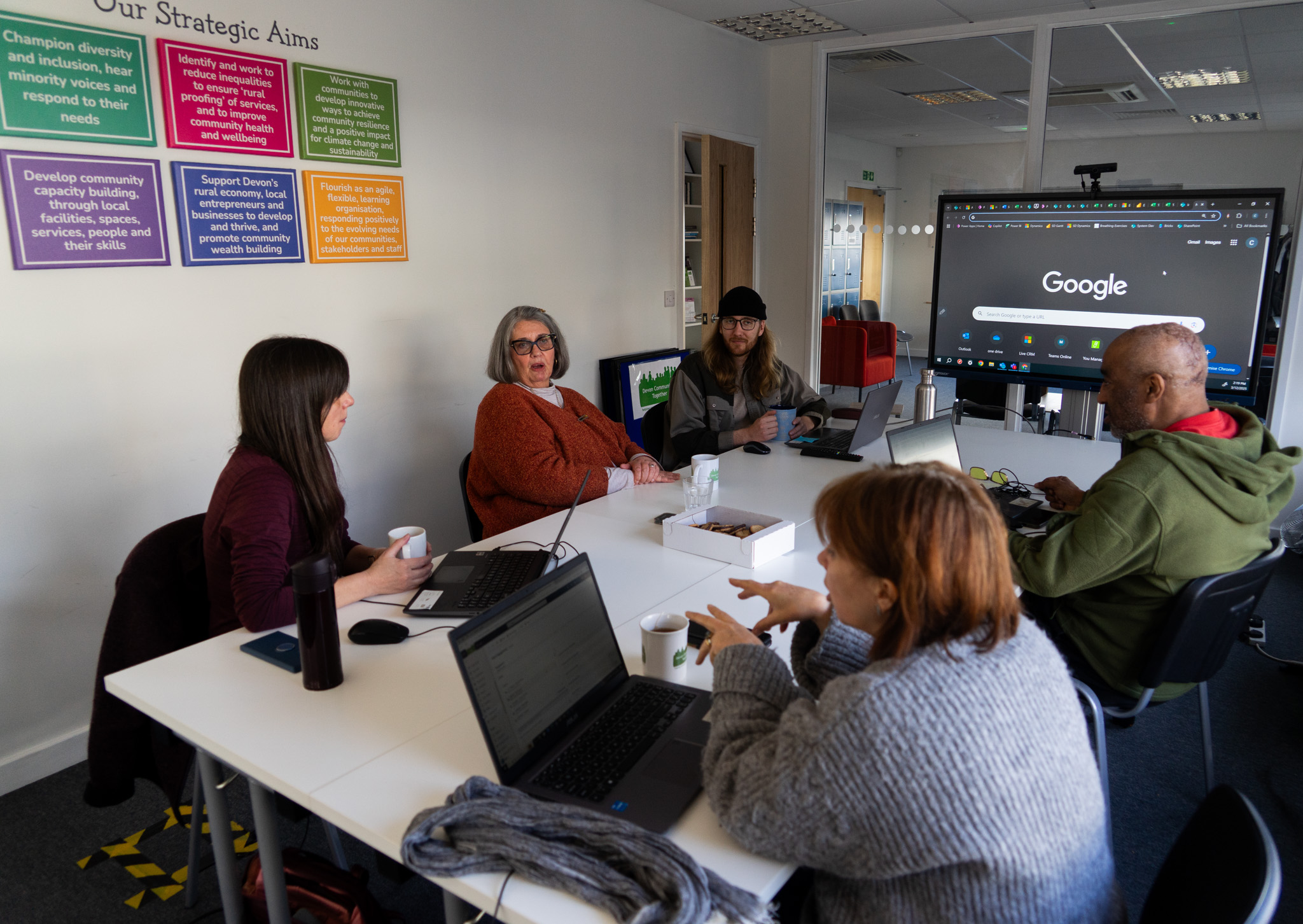 People sitting round the boardroom in a meeting