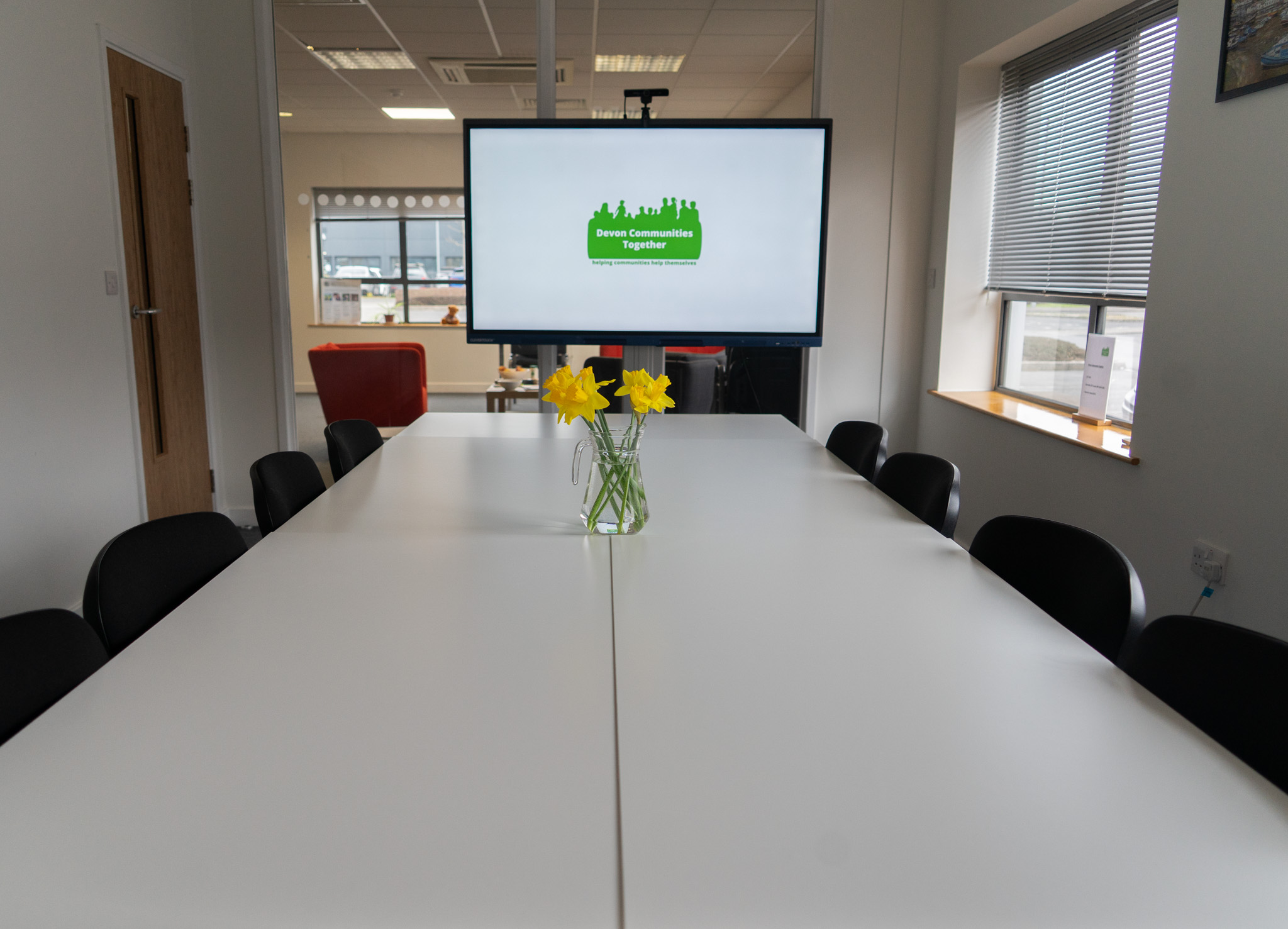 Basic boardroom layout with daffodils on display