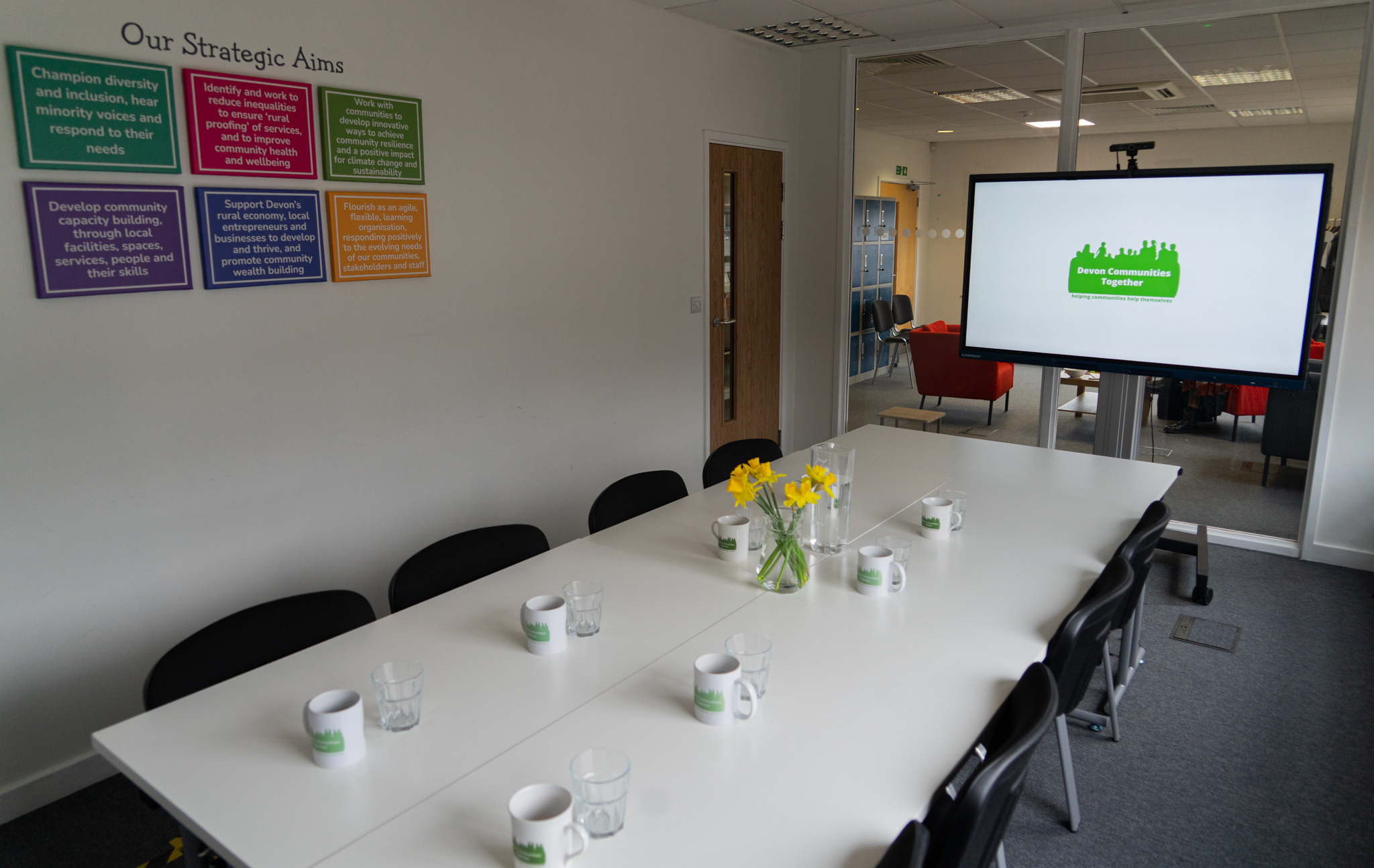 DCT boardroom with daffodils and mugs on the table