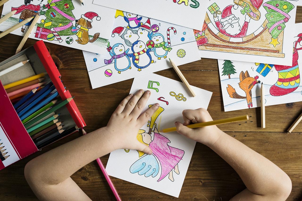 child colouring at a table