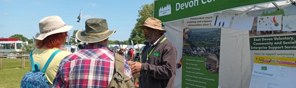 DCT staff member talking to people at the Devon County Show