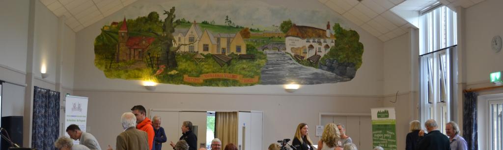 Interior of Filleigh Village Hall with groups of people