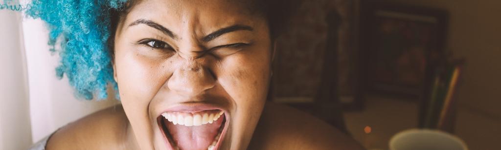 woman with mouth open looking excited and happy