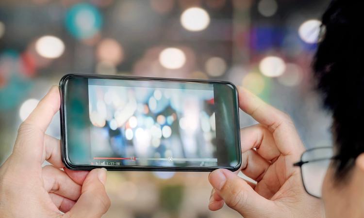 Smart phone taking a video of lights, creating a blurred effect