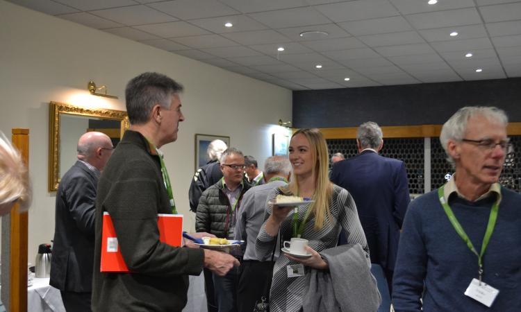 : Mark Brownbill and Shona Plunkett enjoy some cake; Rod Birtles (foreground) – all from Devon Communities Together