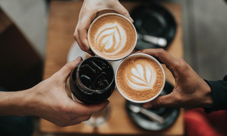 cups of coffee and hands