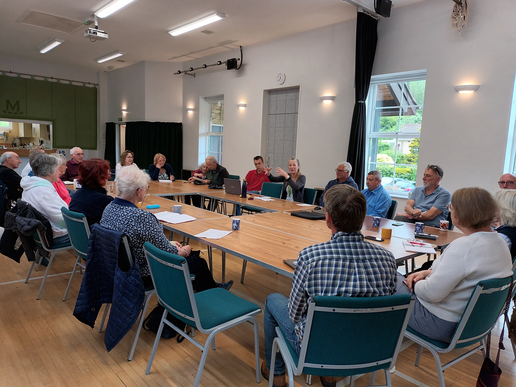 People sat in a village hall