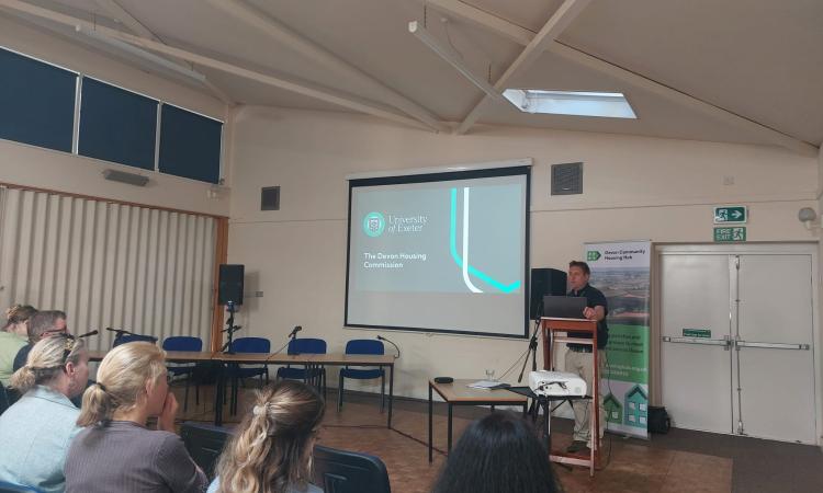 Speaker at a conference addressing the audience
