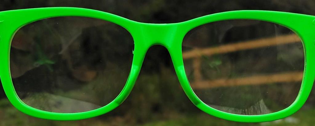bright green glasses looking into a field