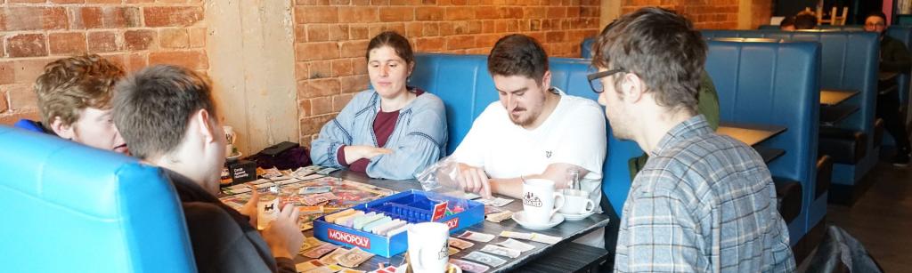 Group of Empowering Enterprise participants playing board games